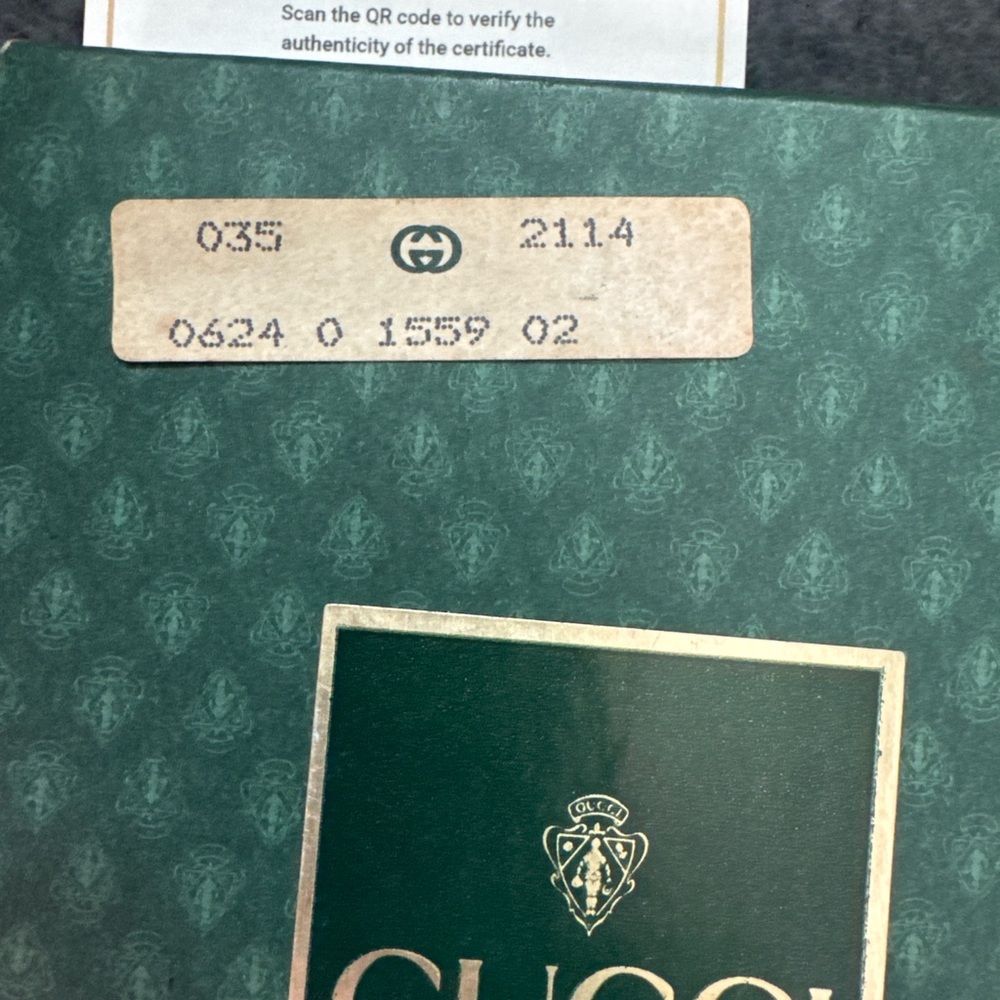 gucci micro GG supreme interlocking clasp bifold wallet